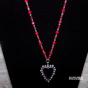Silver toned heart pendant w/ red beaded chain necklace and earrings